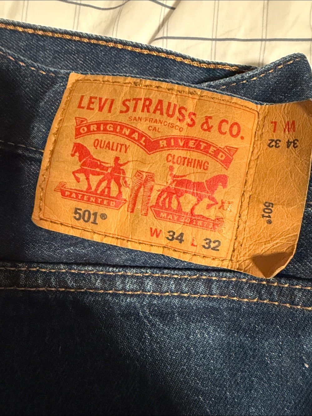 Levi's Men's Straight Jeans in Dark Blue Denim with Tan Patch